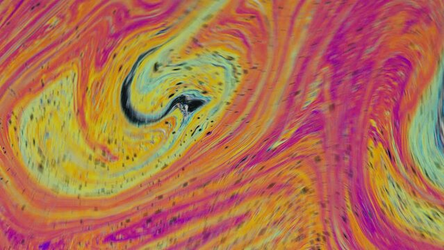 Fluid soap bubble psychedelic colorful abstract art. Surreal patterns with rainbows and waves of color in motion.