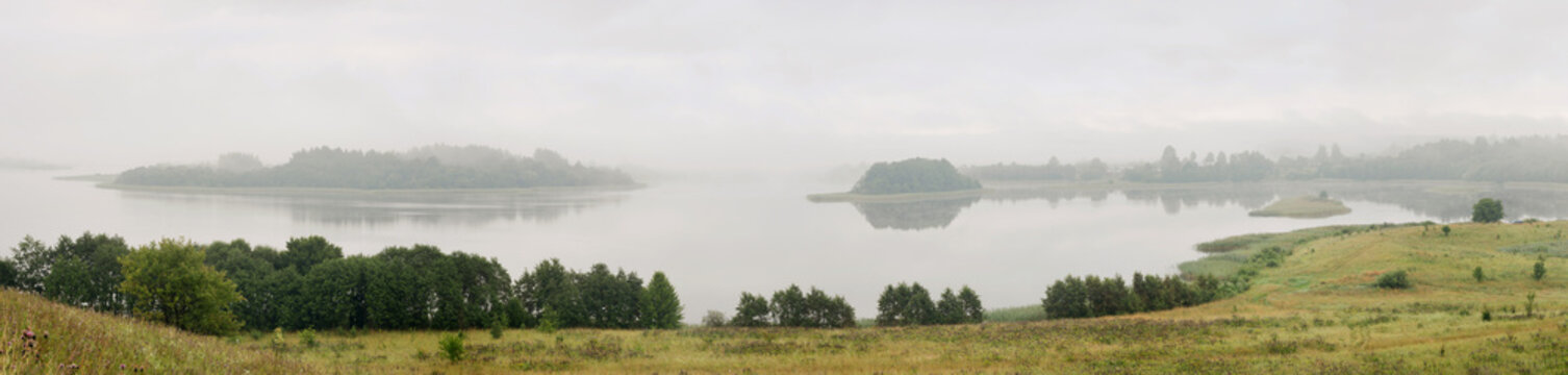 Serene landscape with a lake in the fog