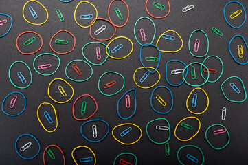 Texture and background of paper clips and rubber bands. Lots of circles in the background....