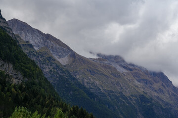 Fototapeta premium magnificent view of Pyrenees mountains with rock outcrops and forest covered slopes
