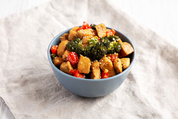 Homemade One-Pan Chicken And Broccoli Stir-Fry in a Bowl, low angle view.