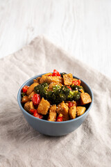 Homemade One-Pan Chicken And Broccoli Stir-Fry in a Bowl, side view. Copy space.