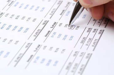 Human hand checking the balance or accouting finances