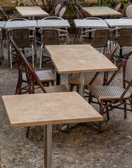 Fototapeta na wymiar tables and chairs in a cobbled street for drinking and dining outside