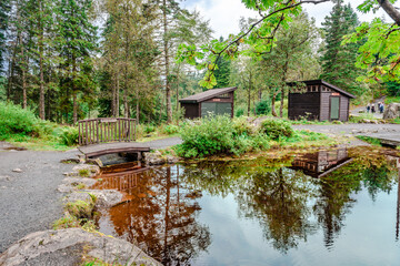 Obraz premium View of lake Skomakerdiket and of the trail around the lake, just a short walk away from Fløibanen's top station, on Mt Floyen, Bergen, Norway