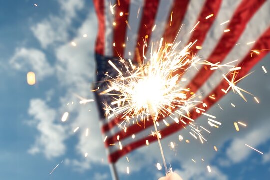 Happy 4th of July Independence Day, Sparkler fireworks USA celebration with American flag nature background.