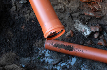 Repair of sewer drain with strong plastic pipe of large diameter in open area