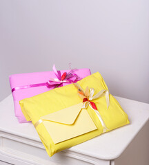 Bright colored paper gift wrapping on a light background
