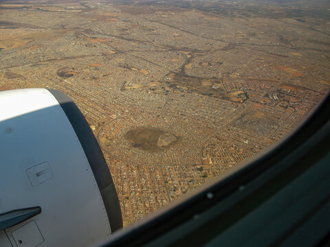 Aerial view of Johannesburg towards Isekelo Pan and surrounding areas, seen from airplane.