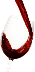 Red wine pouring in glass on background, close-up view