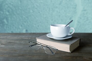 A cup of coffee with book. Stay home and relaxing concept.