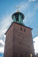 Sweden, Stockholm - July 16, 2022: City Hall or Stadshuset. Closeup of golden triple crown,...