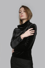 Serie of studio photos of female model wearing plush black turtleneck, elegant yet cozy and warm clothng.