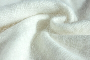 Background fabric texture of Angora. Background texture of white pattern knitted fabric made of...