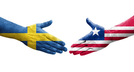 Handshake between Liberia and Sweden flags painted on hands, isolated transparent image.