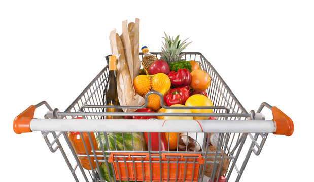 Shopping cart filled with various groceries in store