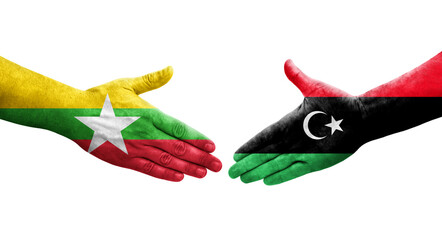 Handshake between Libya and Myanmar flags painted on hands, isolated transparent image.