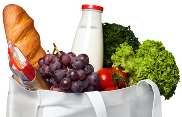 Shopping bag with grocery products on white background