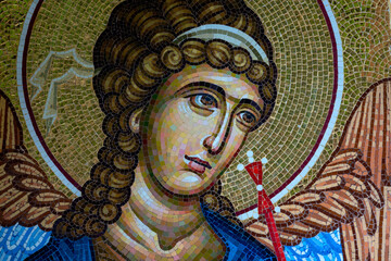 Detail of byzantine or orthodox mosaic icon depicting the head of an Angel. - obrazy, fototapety, plakaty