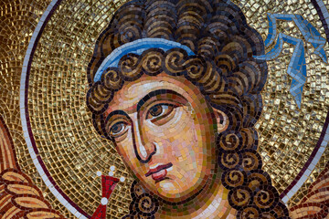 Detail of byzantine or orthodox mosaic icon depicting the head of an Angel. - obrazy, fototapety, plakaty