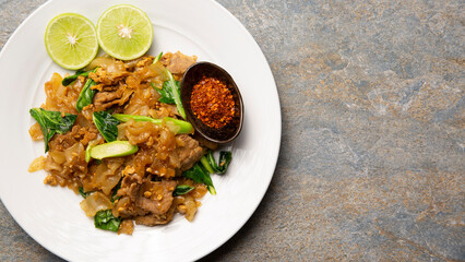 Closeup delicious asian Thai food that cuisine have organic ingredient is fresh Thai kale, rice noodle, lime and garlic.Healthy tasty and vitamin.