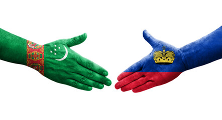 Handshake between Liechtenstein and Turkmenistan flags painted on hands, isolated transparent image.