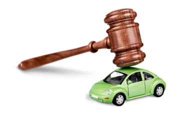 Justice gavel and car isolated on white