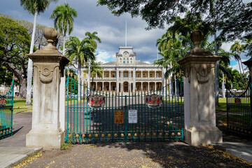 Entrance gate to the 'Iolani Palace grounds on South King Street in the Capitol District of...