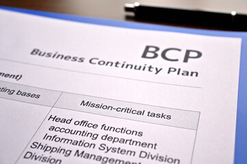 There is dummy documents that created for the photo shoot on the desk about Business Continuity...