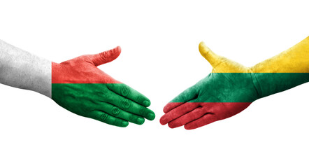 Handshake between Lithuania and Madagascar flags painted on hands, isolated transparent image.