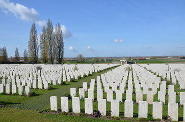 Fototapeta na wymiar Tyne Cot Cemetery near Ypres, Belgium, with graves of soldiers who died in the first world war.