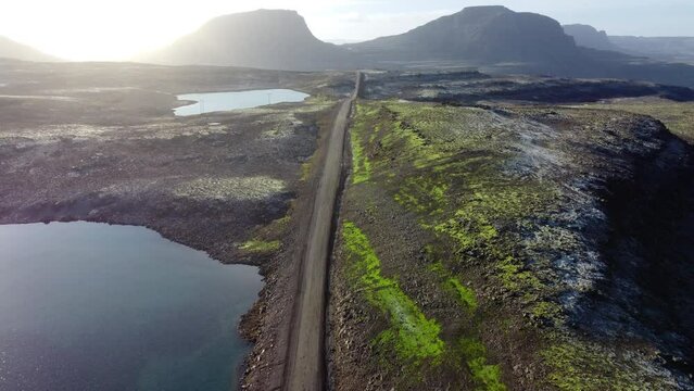 Road landscape in Iceland, beautiful volcanic nature in sunny weather, travel destination gravel f road