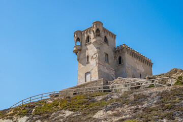 Hill with vegetation and fence and Santa Catalina castle in neo-renaissance style on top, Tarifa...