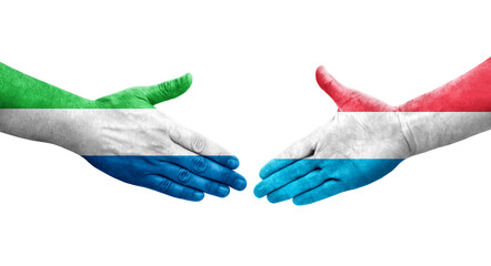 Handshake between Luxembourg and Sierra Leone flags painted on hands, isolated transparent image.