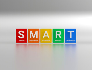 The abbreviation SMART is a strategy for setting goals and objectives. Colored cubes with the abbreviation S.M.A.R.T. - Specific, Measurable, Achievable, Relevant and Time bound. 3D rendering