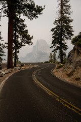 Fototapeta premium Curve of Glacier Point Road On Smoky Day