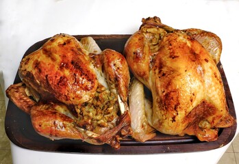 Two golden roasted turkeys top view