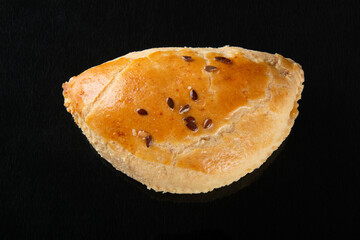 oven pastel. Party food. isolated black background