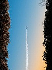 Symmetrical airplane flying and his smoke trails in the sky from puerto rico tunnel de guajataca...