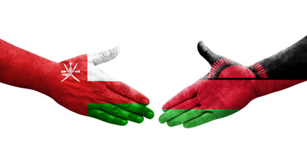 Handshake between Malawi and Oman flags painted on hands, isolated transparent image.