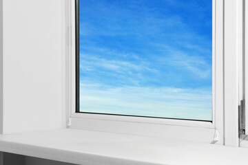 Window with empty white sill, closeup view