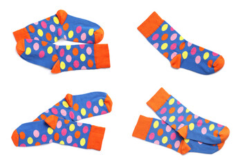 Set with pairs of new socks with pattern on white background, top view