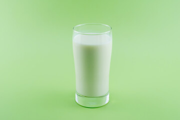 Glass of milk on green background,Healthy Lifestyle
