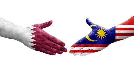 Handshake between Malaysia and Qatar flags painted on hands, isolated transparent image.