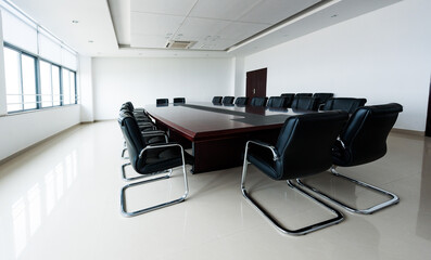 Fototapeta na wymiar Conference table and chairs in modern meeting room