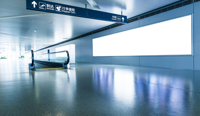 Blank billboard and escalator at a international airport