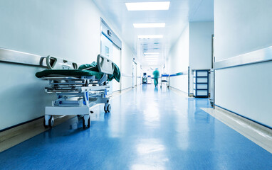 Naklejka na ściany i meble Doctors or nurses walking in hospital hallway, blurred motion