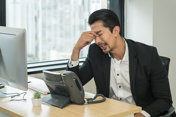 businessman having office syndrome with symptom of getting stress and headache