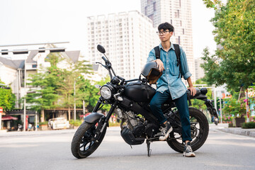 Fototapeta na wymiar Image of Asian man sitting on his motorcycle