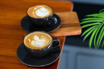 hot latte art coffee on wood table, relax time